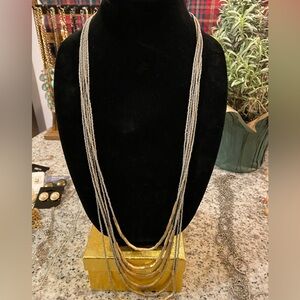 Beautifully draping gray/gold sea bead necklace